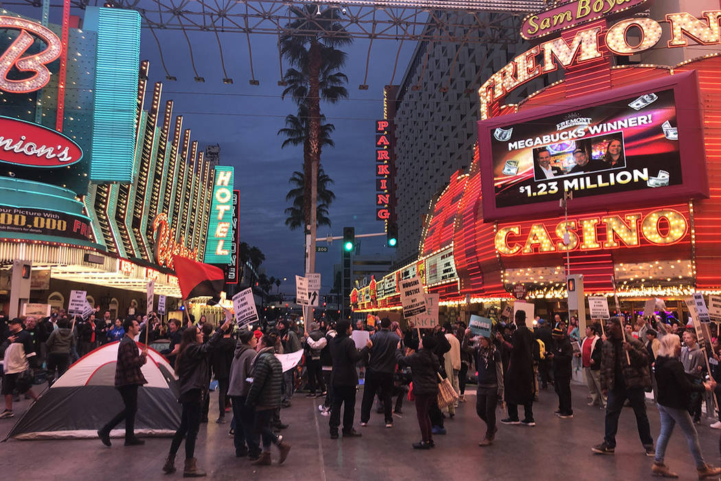 Activists gathered Monday, Jan. 20, 2020, in downtown Las Vegas to protest the two controversia ...