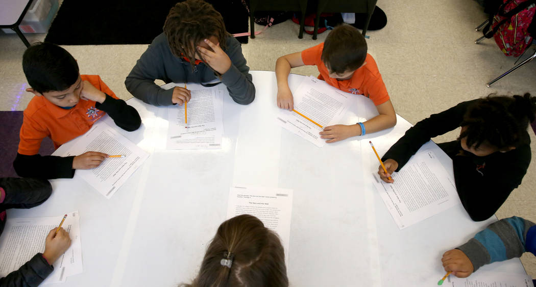 Third grade teacher Laura Ernst works with students at Mater Academy Mountain Vista charter sch ...