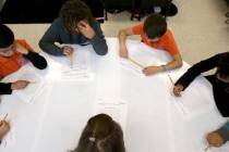 Third grade teacher Laura Ernst works with students at Mater Academy Mountain Vista charter sch ...