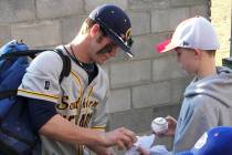 Bryce Harper is shown signing an autograph during his brief college baseball career at the Coll ...