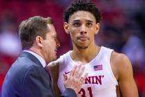 UNLV Rebels head coach T. J. Otzelberger confers with UNLV Rebels guard Marvin Coleman (31) on ...