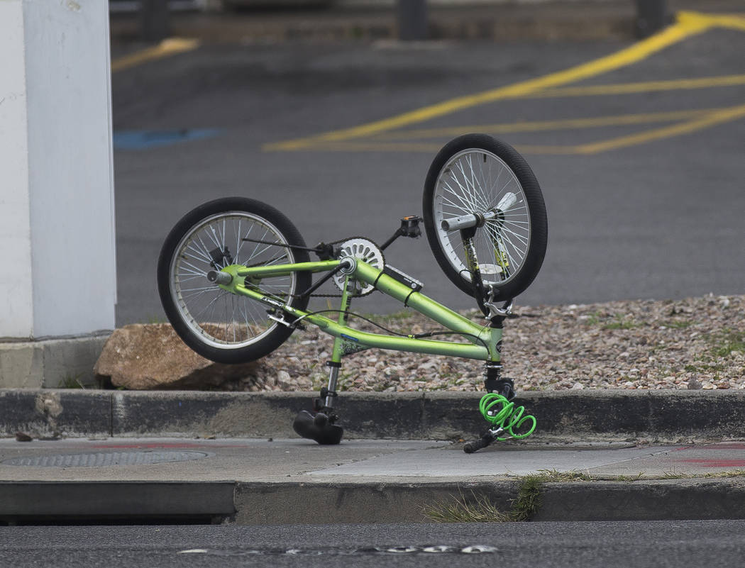 The bike of the 12-year-old boy that was struck by a car and seriously injured while riding on ...