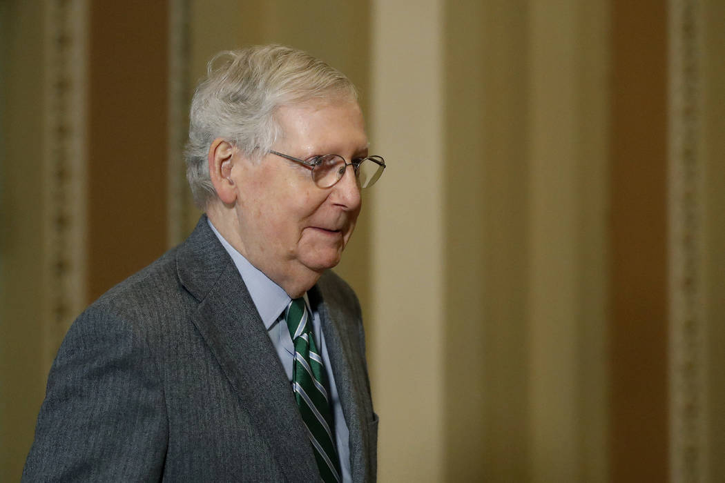 Senate Majority Leader Mitch McConnell, R-Ky., leaves the Senate chamber on Capitol Hill in Was ...