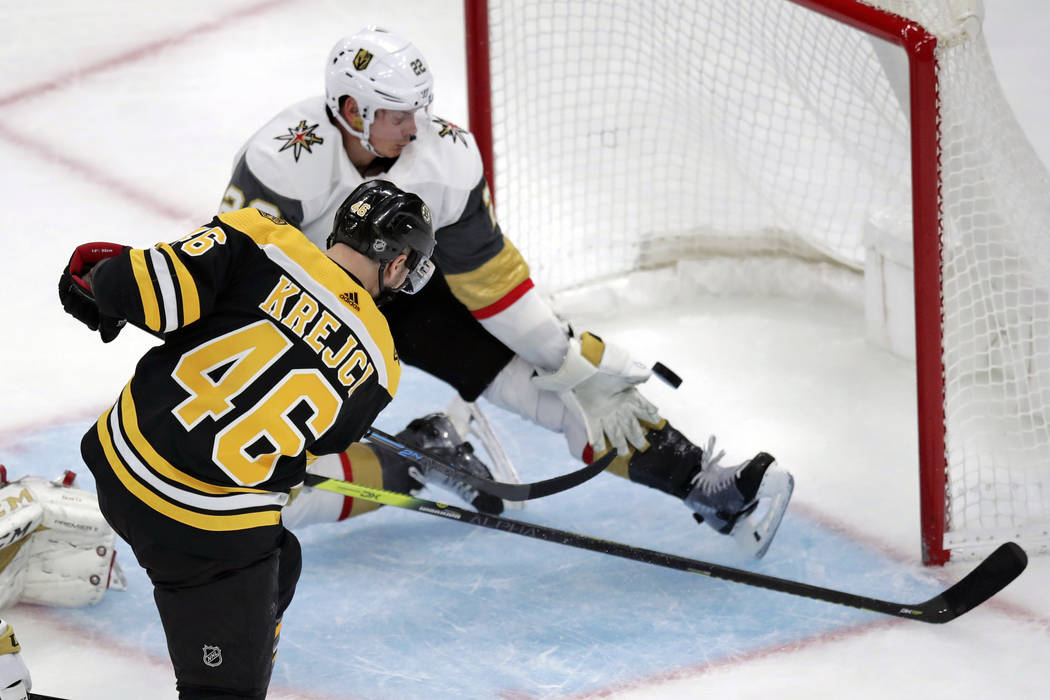 Boston Bruins center David Krejci (46) beats Vegas Golden Knights defenseman Nick Holden (22) f ...