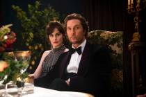 This image released by STXfilms shows Michelle Dockery, left, and Matthew McConaughey in a scen ...