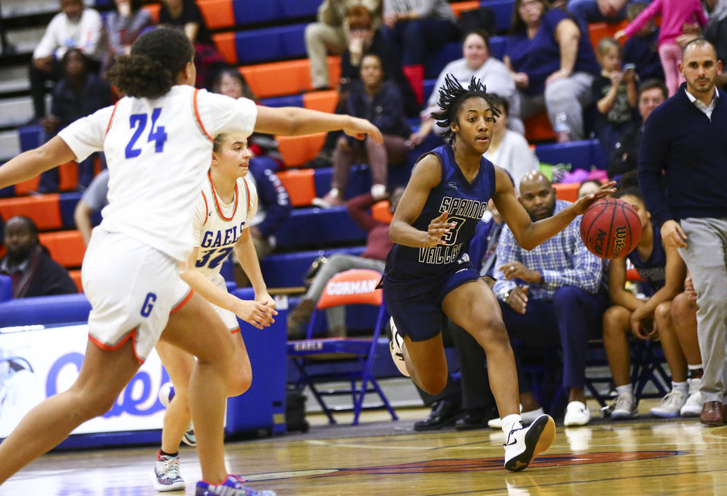 Spring Valley's Aaliyah Gayles (3) drives to the basket past Bishop Gorman's Jordan Kruljac (32 ...