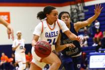 Bishop Gorman's Bentleigh Hoskins (24) drives to the basket against Spring Valley's Chelsea Cam ...