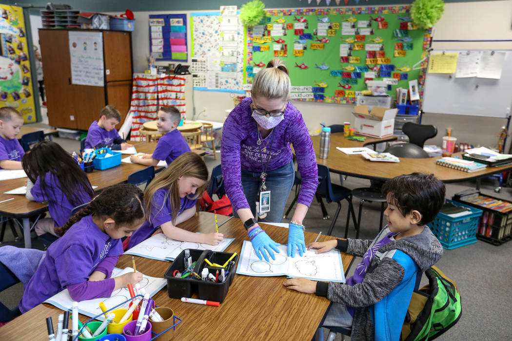 Kindergarteners participate in a class activity led by their teacher Nikki McGuire at Staton El ...