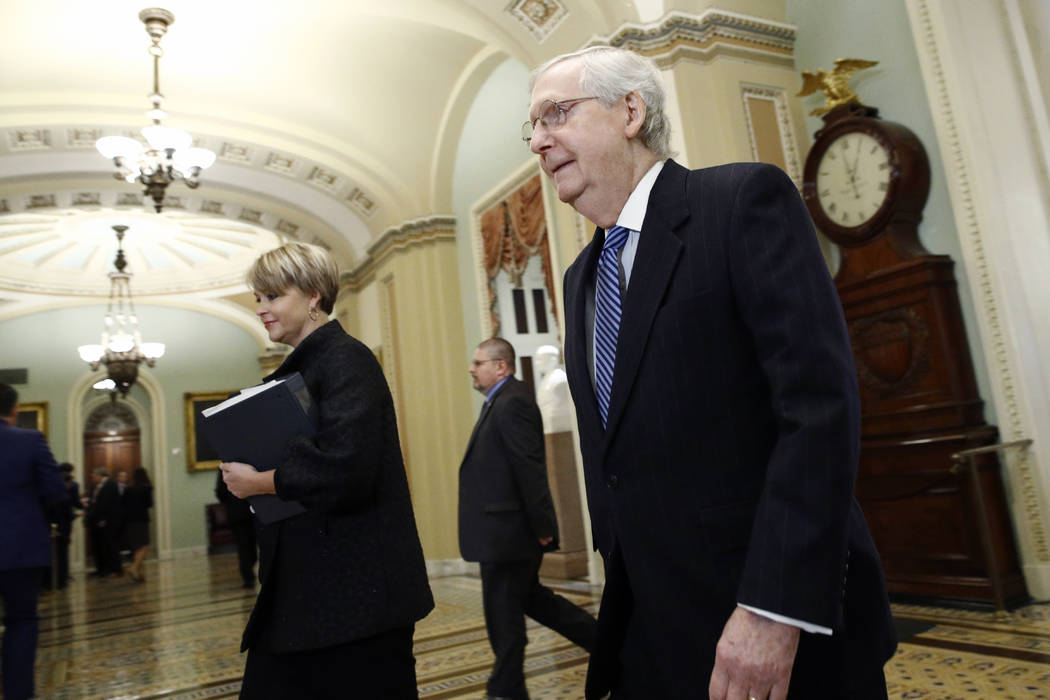 Senate Majority Leader Mitch McConnell, R-Ky., walks to the Senate chamber at the Capitol Wedn ...