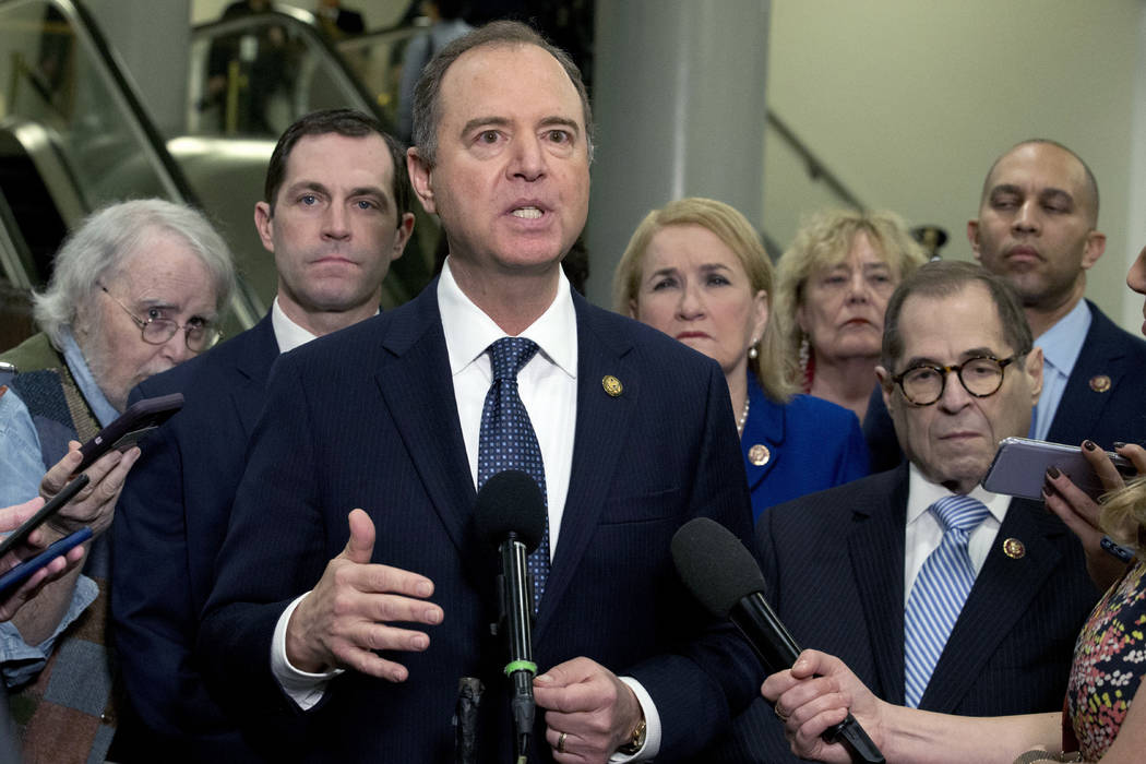 House Intelligence Committee Chairman Adam Schiff, D-Calif., accompanied by the impeachment man ...