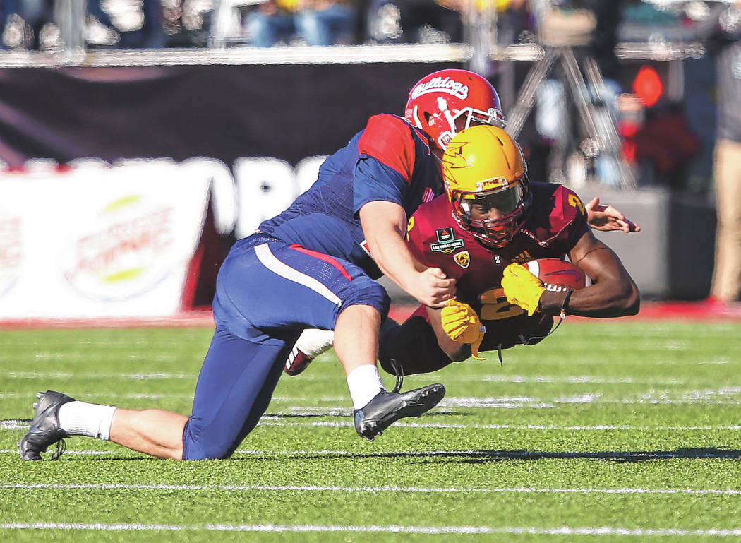 Fresno State place kicker Asa Fuller (37) tackles Arizona State wide receiver Brandon Aiyuk (2) ...