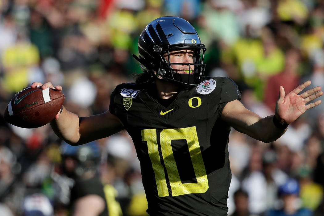 Oregon quarterback Justin Herbert passes against Wisconsin during first half of the Rose Bowl N ...