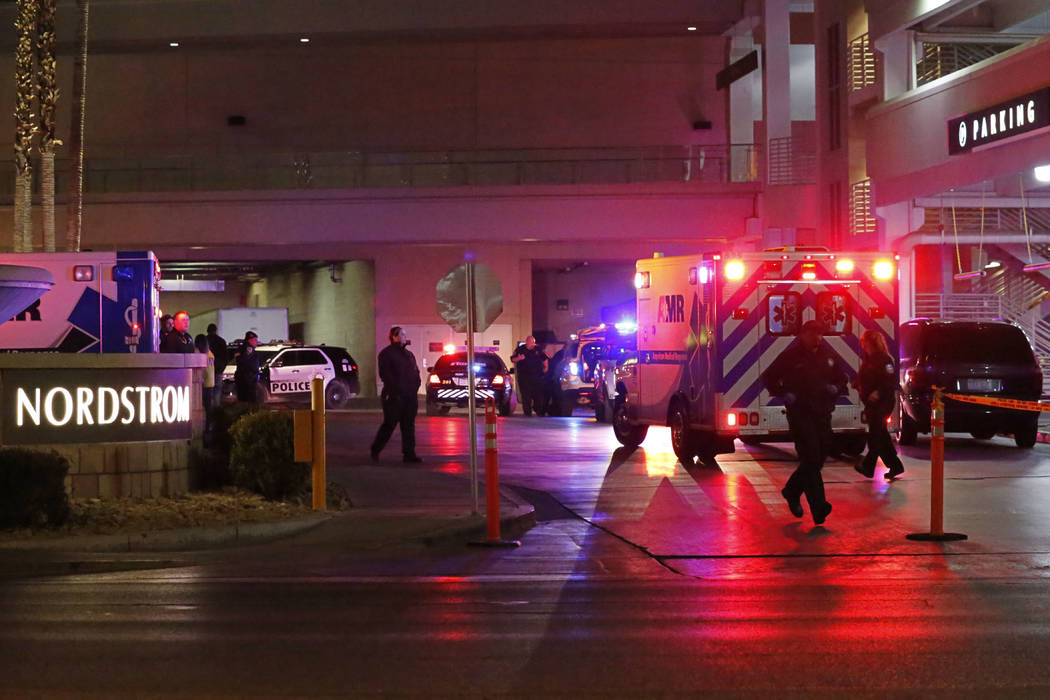 An ambulance comes out from the Nordstrom parking lot at the Fashion Show mall in Las Vegas, T ...