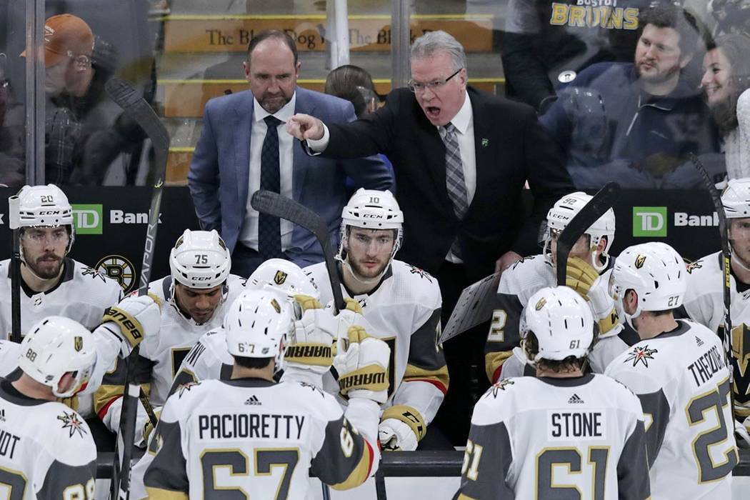 Vegas Golden Knights assistant coach Ryan McGill, right, yells at his players while head coach ...