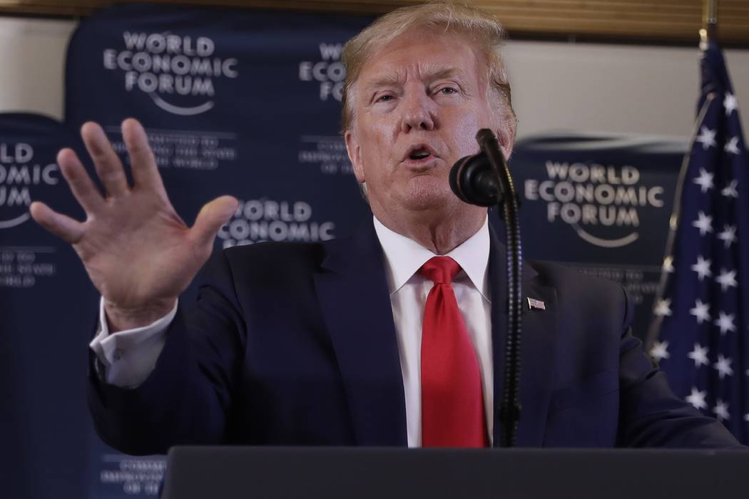US President Donald Trump speaks during a news conference at the World Economic Forum in Davos, ...