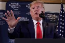 US President Donald Trump speaks during a news conference at the World Economic Forum in Davos, ...