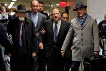 Harvey Weinstein, center, accompanied by attorney Arthur Aidala, right, arrives at court for hi ...