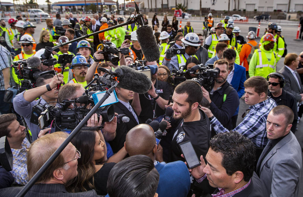 Las Vegas Raiders quarterback Derek Carr (4) answers media questions during a special announcem ...