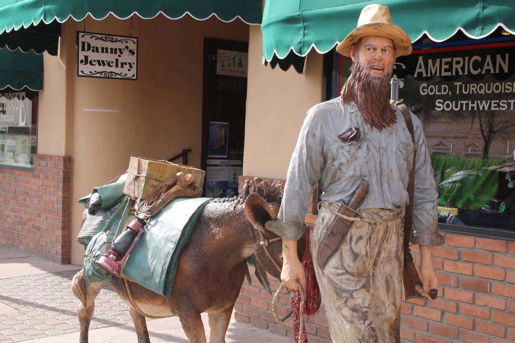 One of six large bronze statues created by artist J. Seward Johnson that can be found on a self ...