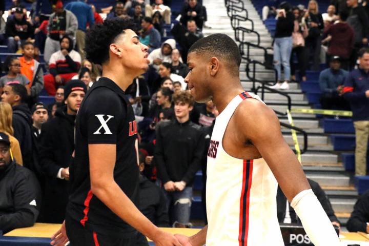 Liberty High's guard Julian Strawther, left, and Coronado High's Jaden Hardy shake hands after ...