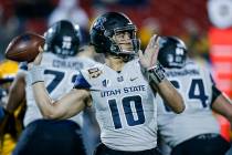 Utah State quarterback Jordan Love (10) looks to pass during the first half of the Frisco Bowl ...