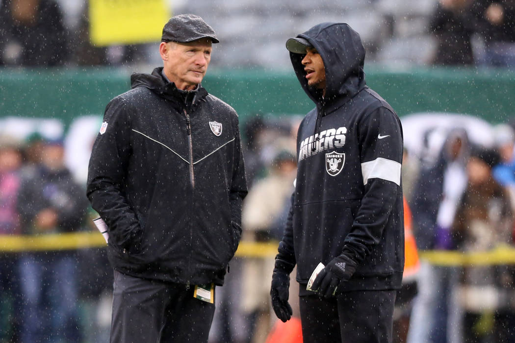 Oakland Raiders general manager Mike Mayock and safety Johnathan Abram (24) have a discussion o ...