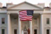 In a Sept. 2017, file photo, a flag is waved outside the White House, in Washington. The Trump ...
