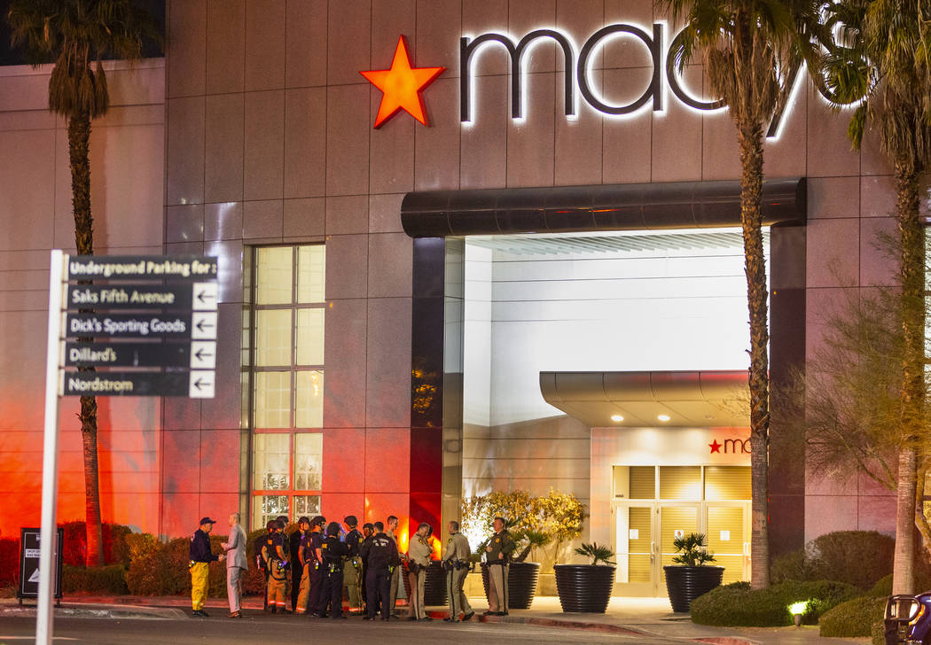 Metropolitan Police Department officers stage at a Fashion Show Mall entrance near Macy's for a ...