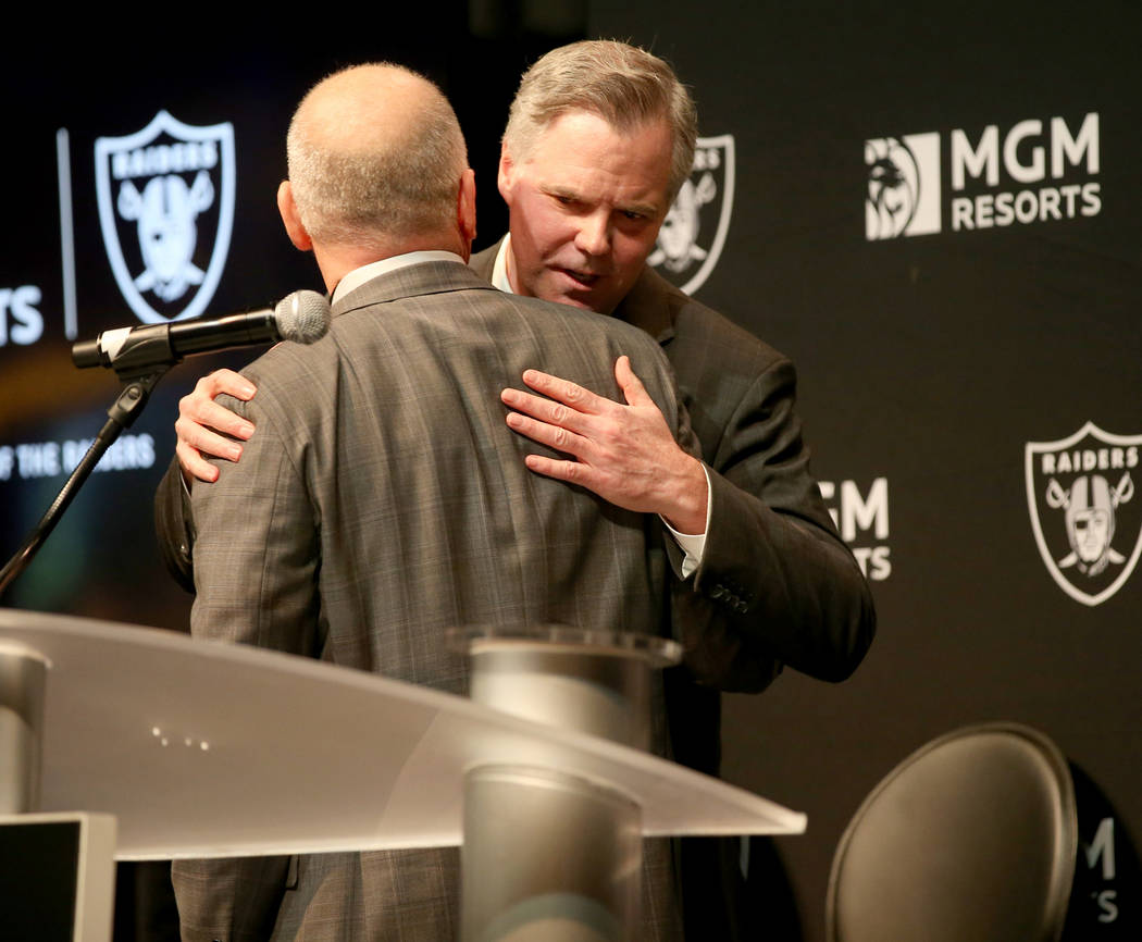 Raiders president Marc Badain, left, and Jim Murren, MGM Resorts CEO and chairman, announce a p ...