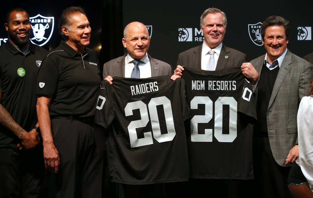 Raiders greats Darren McFadden, from left, Jim Plunkett, Raiders President Marc Badain, Jim Mur ...