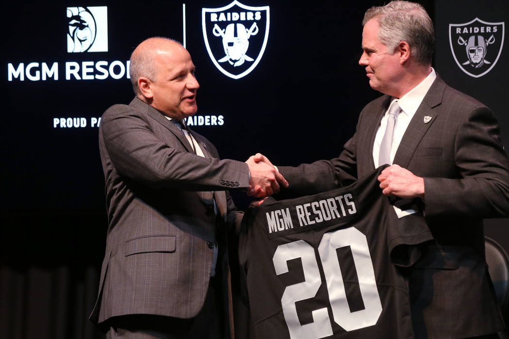 Raiders President Marc Badain, left, and Jim Murren, MGM Resorts CEO and chairman, announce a p ...