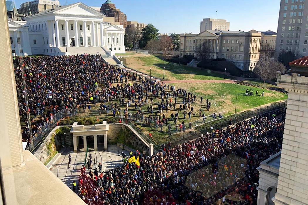 Demonstrators are seen during a pro-gun rally, Monday, Jan. 20, 2020, in Richmond, Va. Thousand ...