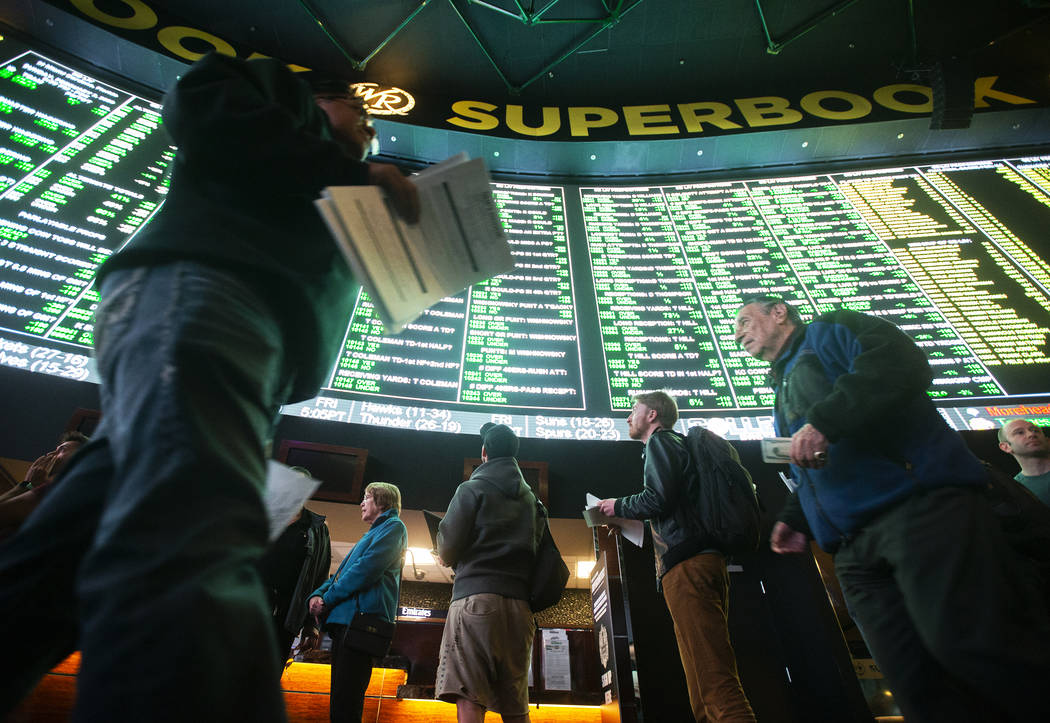 Bettors wait in line at Westgate Sportsbook as Super Bowl prop bets are listed on Thursday, Jan ...