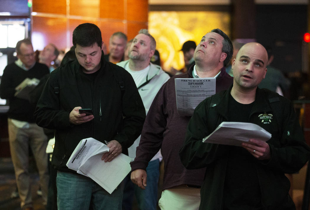 Bettors wait in line at Westgate Sportsbook as Super Bowl prop bets are listed on Thursday, Jan ...