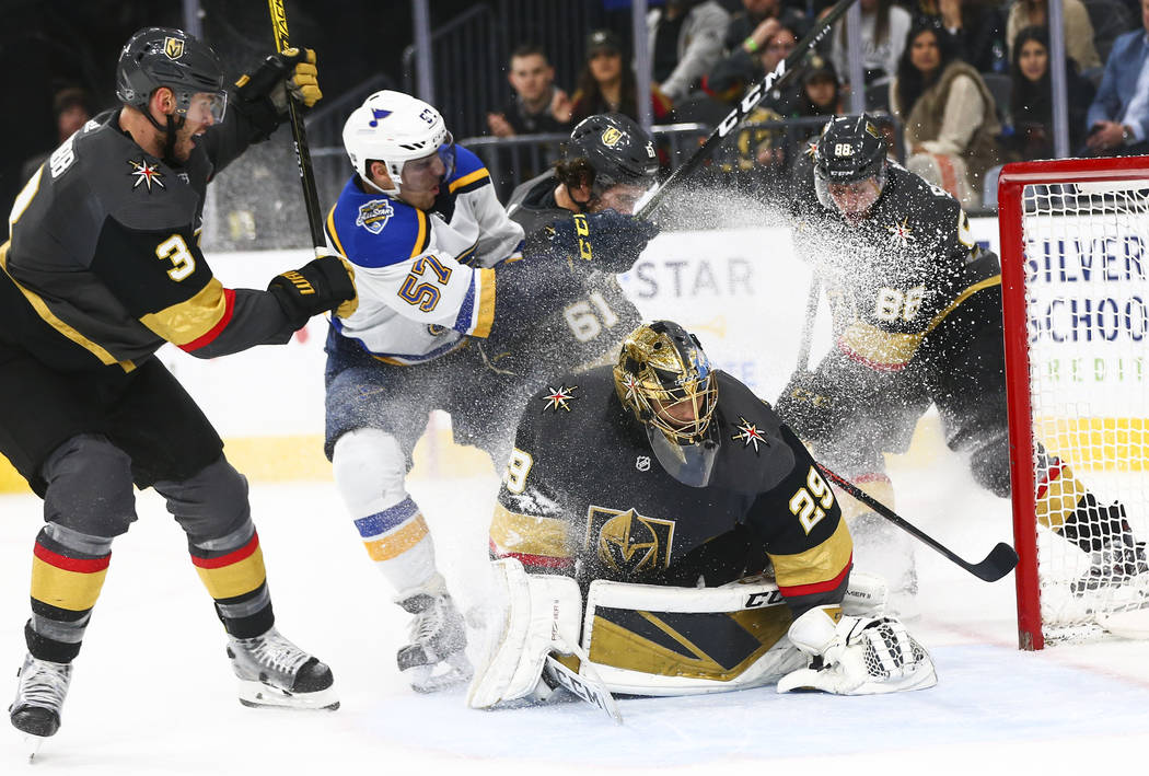 Golden Knights goaltender Marc-Andre Fleury (29) blocks the puck in front of St. Louis Blues' D ...