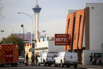 Las Vegas firefighters respond to the scene of a fire at the Alpine Apartment Motel in downtown ...