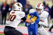 Wisconsin's Zack Barn (56) blocks Wyoming's Logan Wilson (30) as the North squad practices for ...