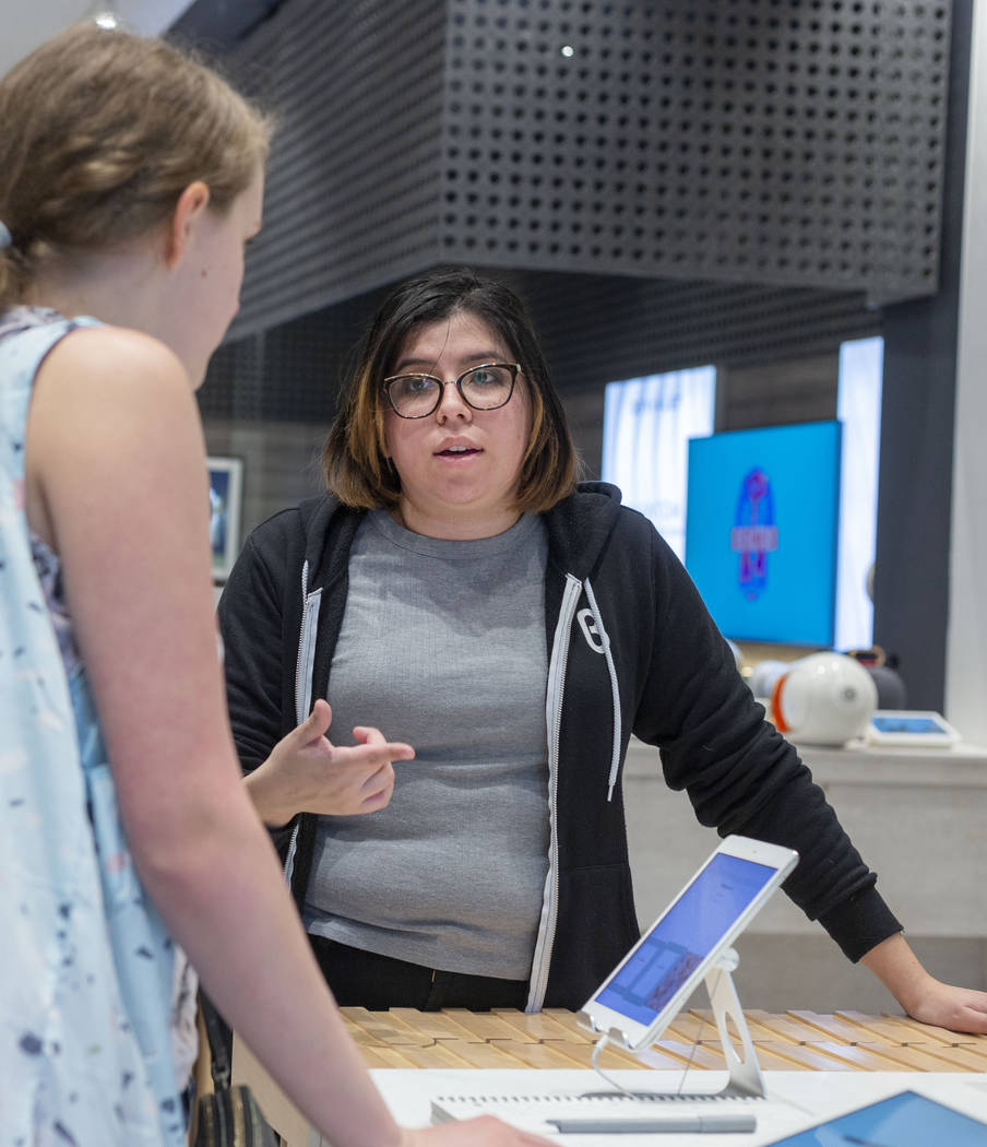 b8ta tester Melissa Avalos, right, discusses different products with Jamie Halverson of Iowa Ci ...