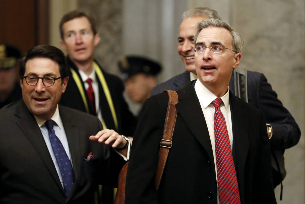 President Donald Trump's personal attorney Jay Sekulow, left, walks with White House Counsel Pa ...