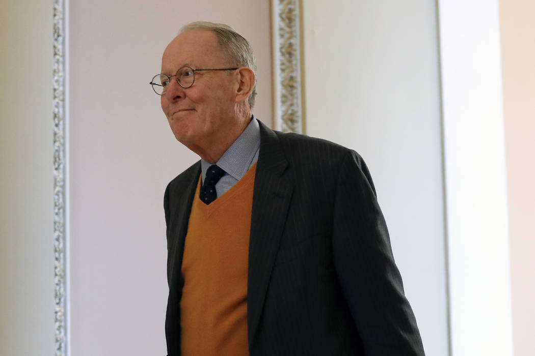 Sen. Lamar Alexander, R-Tenn., walks to the Senate chamber at the Capitol in Washington during ...