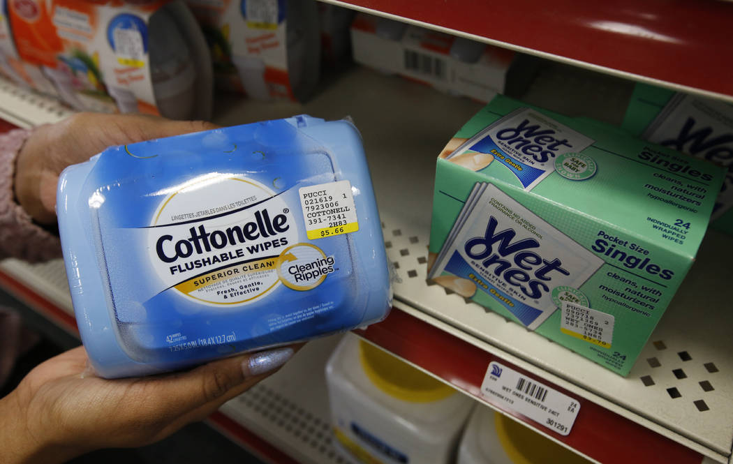 Alice White displays a package of Cottonelle single use flushable wipes at Pucci's Leader Pharm ...
