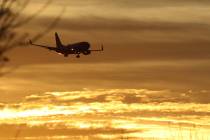 A Southwest Airlines plane approaches McCarran International Airport during sunrise on Friday, ...