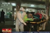 In this Thursday, Jan. 23, 2020, image from China's CCTV video, a patient is carried on a stret ...