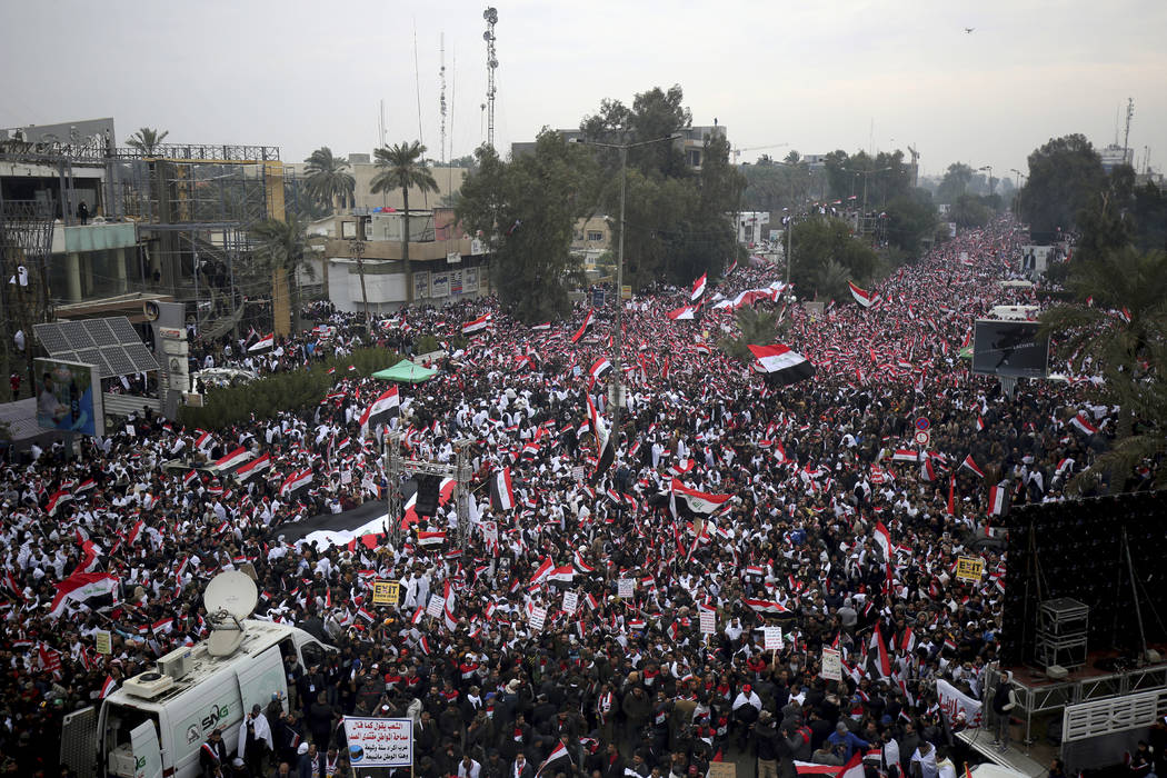 Followers of Shiite cleric Muqtada al-Sadr gather in Baghdad, Iraq, Friday, Jan. 24, 2020. Thou ...