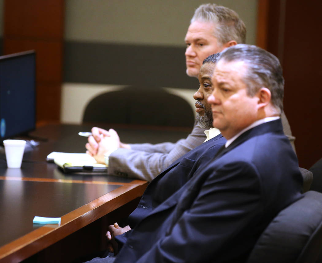 Charles Talley Jr., center, listens as the jury is polled after he was found guilty of murder a ...