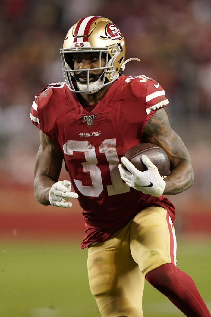 San Francisco 49ers running back Raheem Mostert (31) runs against the Green Bay Packers during ...