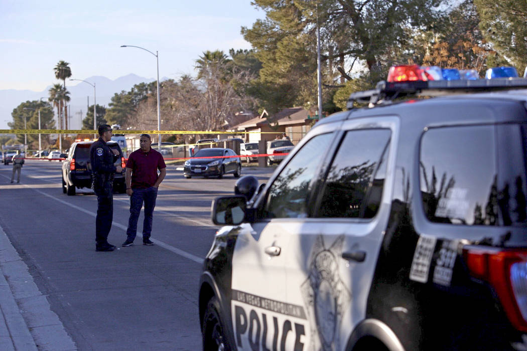 Las Vegas police investigate a shooting near Desert Pines High School in Las Vegas, Friday, Jan ...