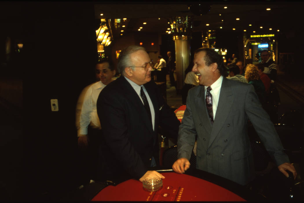 Dunes blackjack pit boss Earl Brookner, in glasses, and longtime Dunes patron Danny Salyers tal ...