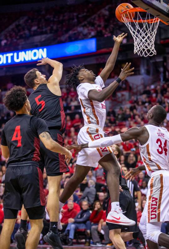 UNLV Rebels forward Donnie Tillman (2,right) gets inside of San Diego State Aztecs forward Matt ...