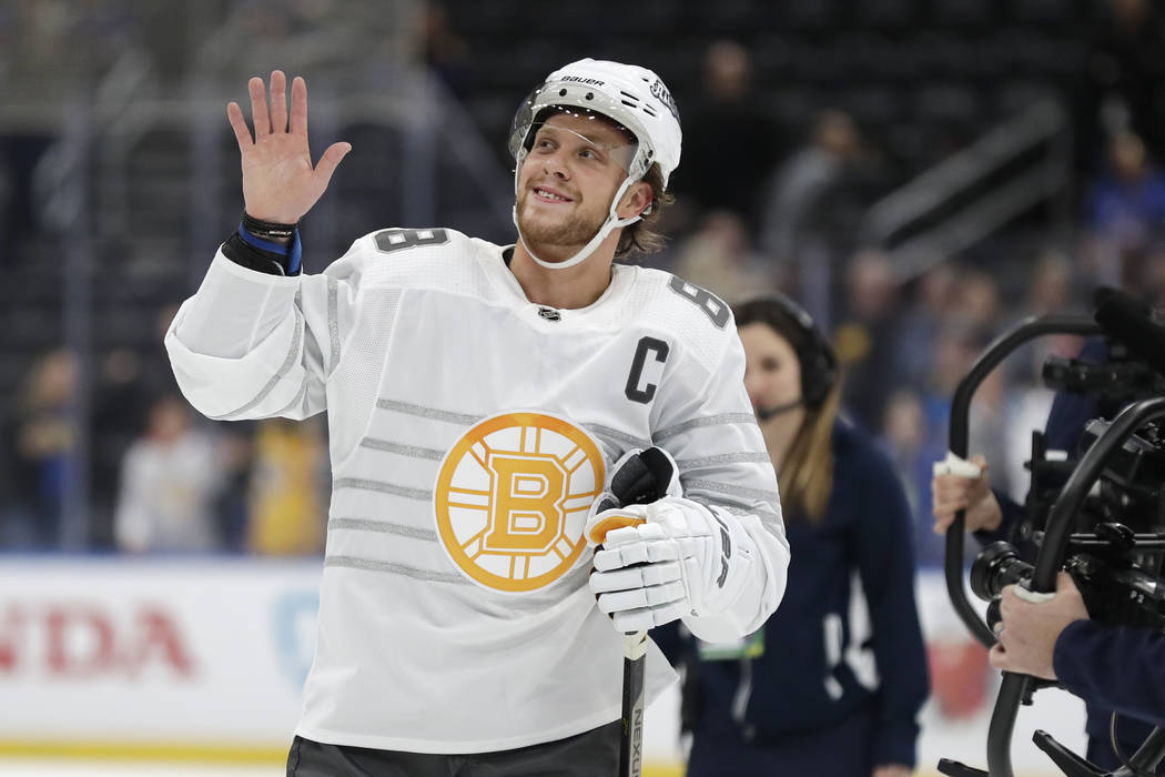 Boston Bruins forward David Pastrnak waves to the crowd as he is named the most valuable player ...